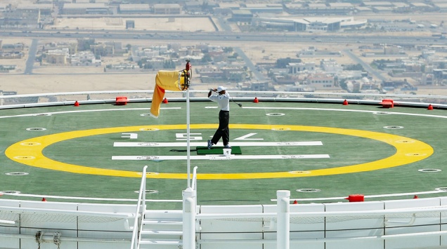 DUBAI, UNITED ARAB EMIRATES - MARCH 2:  Tiger Woods of the USA hits balls from the heli-pad on top of the Burj Al Arab Hotel before the 2004 Dubai Desert Classic played at the Emirates Golf Club, on March 2, 2004 in Dubai, United Arab Emirates.  (Photo by David Cannon/Getty Images)  *** Local Caption *** Tiger Woods